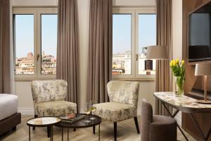 Uma área de estar em FH55 Grand Hotel Palatino