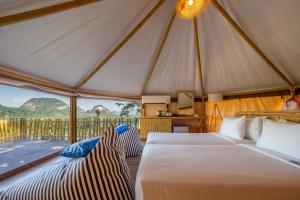 two beds in a tent with a view at Beyond Skywalk Nangshi in Ban Met Nang Chi