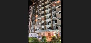 a tall building with balconies on the side of it at Matina Enclaves 2br Condominium short walk to sm city in Davao City