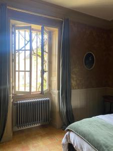 Cama o camas de una habitación en Le Manoir du Plessis