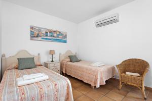 A bed or beds in a room at Villa La Martina