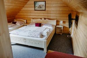 Postel nebo postele na pokoji v ubytování SOVA Hotel&Restaurant