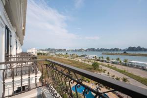 a balcony with a view of the water at Charmhill Hotel - Tuần Châu in Ha Long