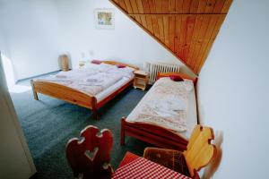 Postel nebo postele na pokoji v ubytování SOVA Hotel&Restaurant