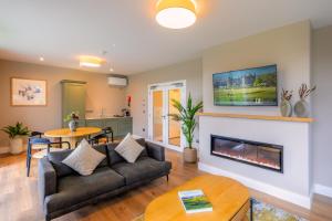 a living room with a couch and a fireplace at Killeen Castle in Dunsany