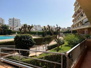 a balcony of a apartment building with a swimming pool at Apartamento duplex LOS IRIS solo familias in Playa de Gandia