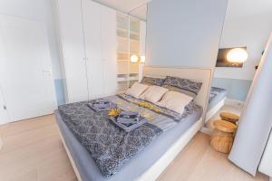 Posteľ alebo postele v izbe v ubytovaní Horyzont Apartamenty -Polanki AQUA- Strefa SPA z basenem i fitness studio, prywatny garaż