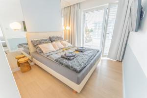 Posteľ alebo postele v izbe v ubytovaní Horyzont Apartamenty -Polanki AQUA- Strefa SPA z basenem i fitness studio, prywatny garaż