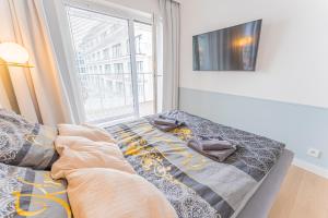 Posteľ alebo postele v izbe v ubytovaní Horyzont Apartamenty -Polanki AQUA- Strefa SPA z basenem i fitness studio, prywatny garaż