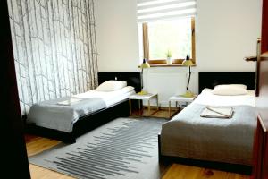 Posteľ alebo postele v izbe v ubytovaní Apartament 007A pod Śnieżką