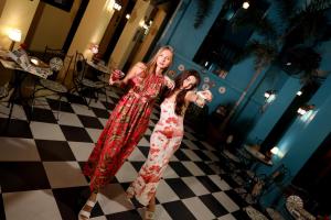 two girls standing in a room playing a video game at The Quba Boutique Hotel Pattaya in Pattaya Central +125 photos