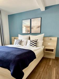 Säng eller sängar i ett rum på Apartmenthaus Hohenfels