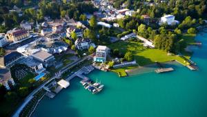 an aerial view of a small town on a lake at Boutique Apartments Velden in Velden am Wörthersee