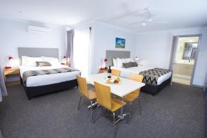 Postel nebo postele na pokoji v ubytování Altitude Motel Apartments