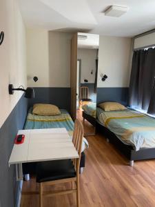 Katil atau katil-katil dalam bilik di Hotel Fauwater