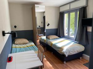 Ein Bett oder Betten in einem Zimmer der Unterkunft Hotel Fauwater