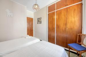 A bed or beds in a room at Avda de Rhode 229 Roses - Immo Barneda