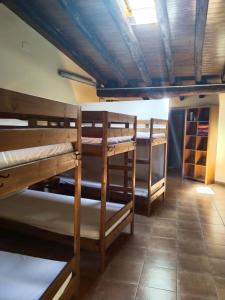 a group of bunk beds in a room at El Refugi in Arboli