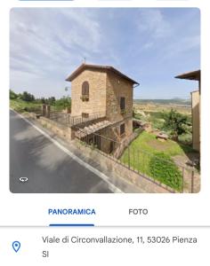 Captura de pantalla de un sitio web con una imagen de un edificio en Il Nido en Pienza
