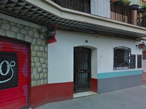 a building with a red door on a street at Old Town Flat by Concept Flats in Valencia