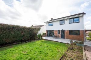 an image of a house with a yard at Trinity View by Tŷ SA - Beautiful 5 bed in Newport in Caerleon