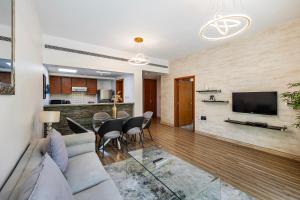 a living room with a couch and a table at Renovated 1 Bed Al Alka 1 In The Greens in Dubai
