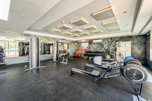 a gym with a treadmill and a bike in a room at Renovated 1 Bed Al Alka 1 In The Greens in Dubai