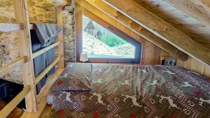 Posteľ alebo postele v izbe v ubytovaní Ca' Scocc, antica casa di montagna in Valsesia