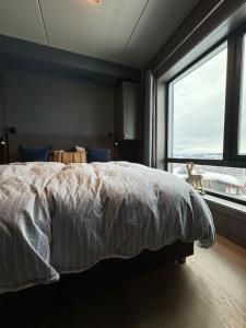Tempat tidur dalam kamar di Riddertunet Beitostølen