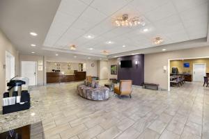 a large lobby with a couch and a living room at Comfort Inn & Suites Lovington in Lovington