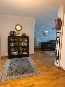a living room with a couch and a table at Lakeview central residence in Savonlinna