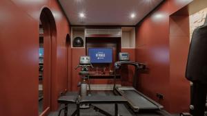 a room with a gym with a treadmill in it at Rosselli AX Privilege in Valletta