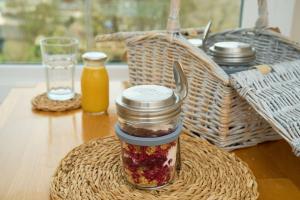 a jar of jam sitting on top of a table at Epchris House in Ilfracombe