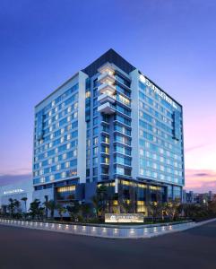 a rendering of a hotel building at night at DoubleTree by Hilton Jakarta Kemayoran in Jakarta