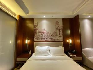 Posteľ alebo postele v izbe v ubytovaní LI HAO Hotel