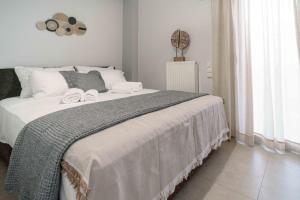 מיטה או מיטות בחדר ב-Acropolis panorama penthouse