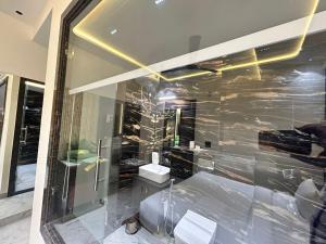 A bathroom at Taj Ronak Luxury Hotels