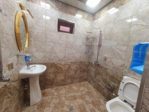 a bathroom with a sink and a toilet at Villa in Quba in Quba