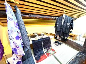 a room with clothes on display in a store at 螢居- 3層100坪別墅 心齋橋道頓堀2站 in Osaka