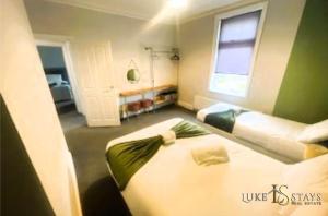 a bedroom with two beds in a room at Luke Stays - Welbeck Road in Old Walker