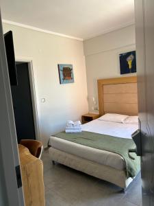 Ένα ή περισσότερα κρεβάτια σε δωμάτιο στο Perea Hotel 