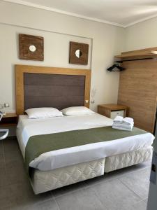 Ένα ή περισσότερα κρεβάτια σε δωμάτιο στο Perea Hotel 