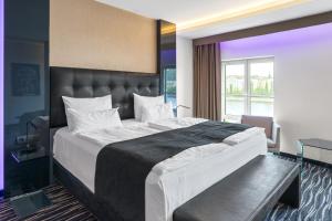 Letto o letti in una camera di Dancing House - Tančící dům hotel