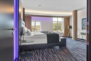 Letto o letti in una camera di Dancing House - Tančící dům hotel