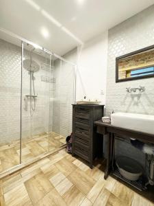a bathroom with a shower and a sink at Na początku in Budzów +27 photos