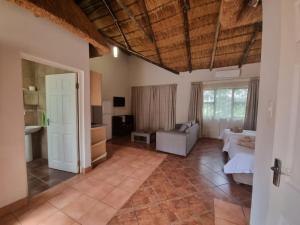 a living room with a couch and a table at Qabuleka BnB in Nongoma