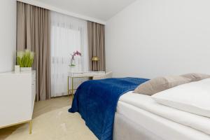 Ліжко або ліжка в номері Luxury Apartment Wynalazek in Mokotów by Renters Prestige