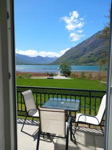 a patio with a view of a lake and mountains at Saraapartman in Plav