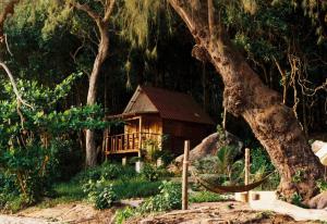 a small cabin in the middle of a forest at KAMAKU Bungalows in Koh Rong Sanloem