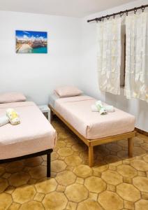 Postel nebo postele na pokoji v ubytování Villa u Gregoria